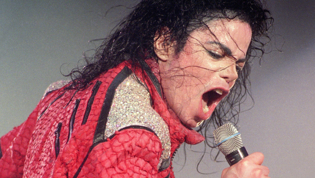 Michael Jackson performs live on stage, 1996. (Photo by Phil Dent/Redferns)