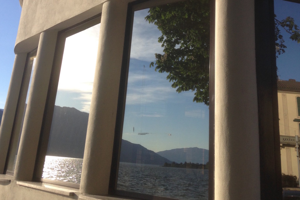La foto del giorno è di Antonella Bonora: "Riflessi sul lago dall'Imbarcadero di Luino"